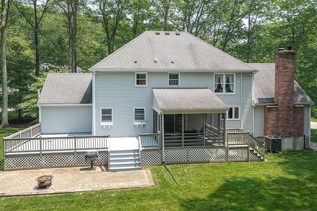 80 Christian Way, North Andover, MA 01845 - back of property with an outdoor fire pit, a lawn, a wooden deck, roof with shingles, and a patio