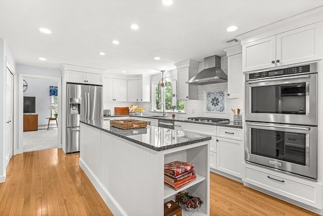80 Christian Way, North Andover, MA 01845 - kitchen with appliances with stainless steel finishes, wall chimney exhaust hood, open shelves, a kitchen island, and recessed lighting