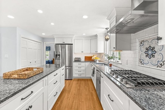 80 Christian Way, North Andover, MA 01845 - kitchen featuring stainless steel appliances, wall chimney exhaust hood, white cabinetry, dark stone counters, and recessed lighting