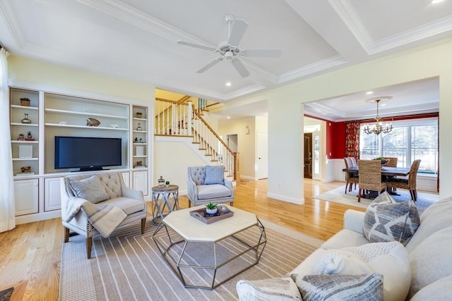 living room featuring beam ceiling, crown molding, ceiling fan with notable chandelier, and light wood-type flooring