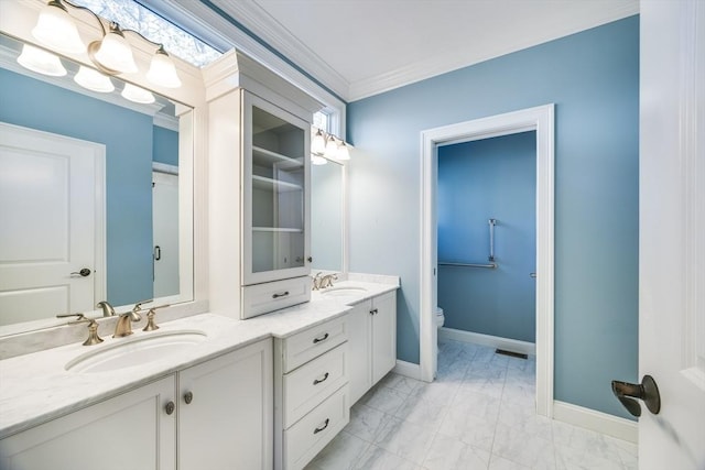 bathroom featuring vanity, crown molding, and toilet