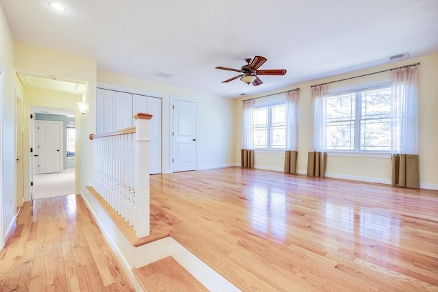 spare room with ceiling fan and light hardwood / wood-style flooring