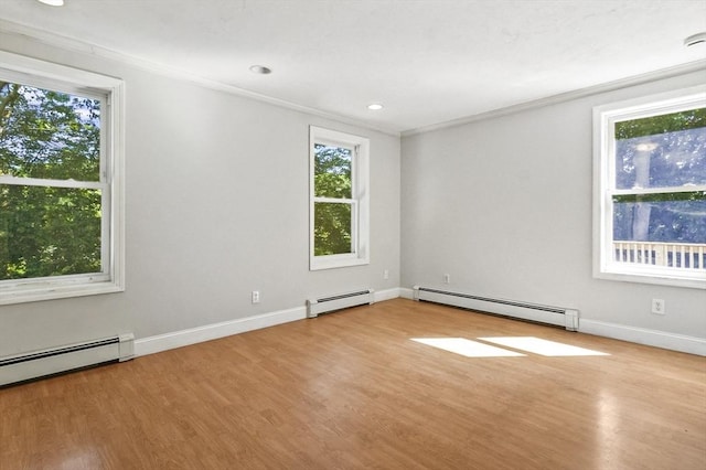 13 Hoyt Ave, Amesbury, MA 01913 - empty room featuring a baseboard radiator, plenty of natural light, crown molding, wood finished floors, and recessed lighting