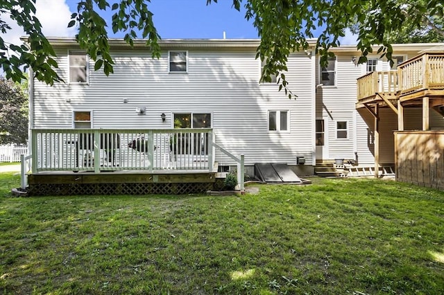 13 Hoyt Ave, Amesbury, MA 01913 - back of house featuring a wooden deck, a lawn, and entry steps