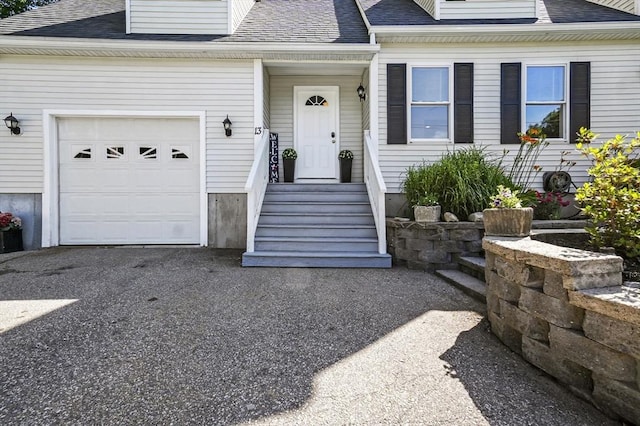 13 Hoyt Ave, Amesbury, MA 01913 - property entrance featuring roof with shingles and an attached garage