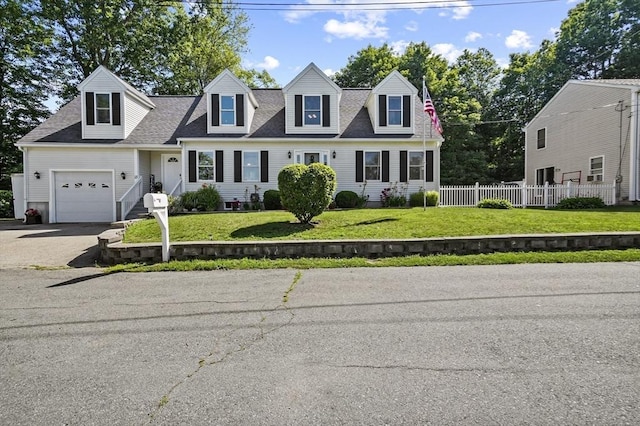 13 Hoyt Ave, Amesbury, MA 01913 - cape cod-style house with a shingled roof, asphalt driveway, and a garage