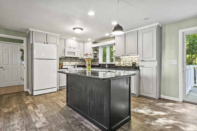 13 Hoyt Ave, Amesbury, MA 01913 - kitchen featuring white appliances, dark countertops, open shelves, tasteful backsplash, and dark wood-type flooring