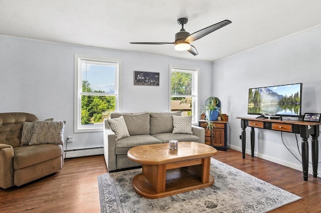 13 Hoyt Ave, Amesbury, MA 01913 - living area with ornamental molding, a baseboard radiator, ceiling fan, and wood finished floors