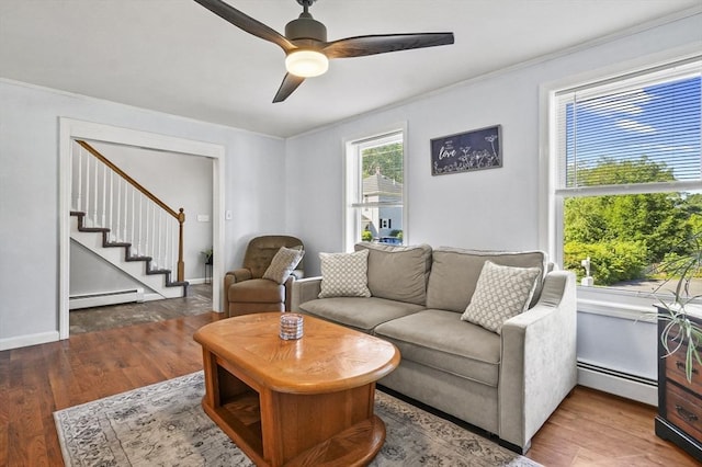 13 Hoyt Ave, Amesbury, MA 01913 - living area with a baseboard radiator, wood finished floors, stairway, a ceiling fan, and crown molding