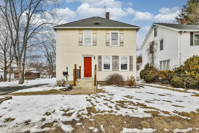 view of front of home with a chimney