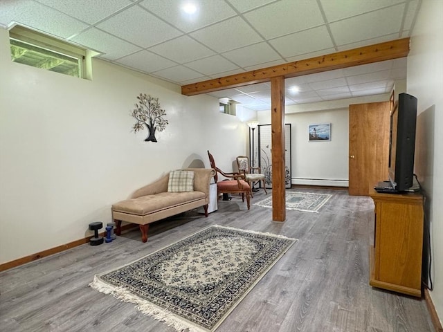233 Old Wendell Rd, Northfield, MA 01360 - sitting room with a baseboard radiator, wood finished floors, and a paneled ceiling