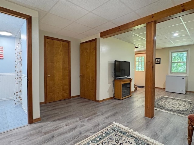 233 Old Wendell Rd, Northfield, MA 01360 - unfurnished living room with a paneled ceiling and wood finished floors