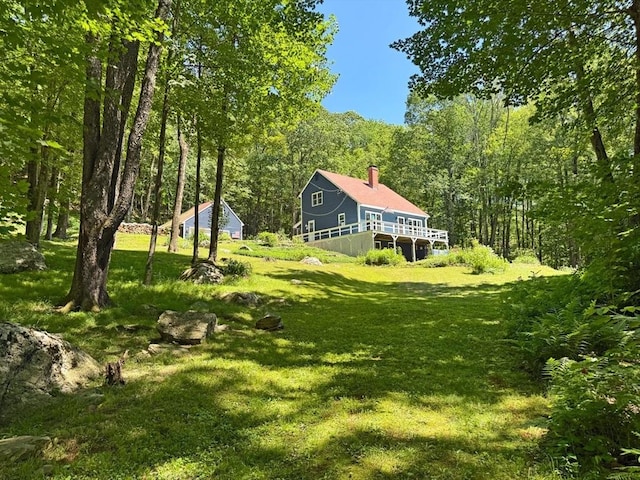 233 Old Wendell Rd, Northfield, MA 01360 - view of green lawn featuring a view of trees and a deck