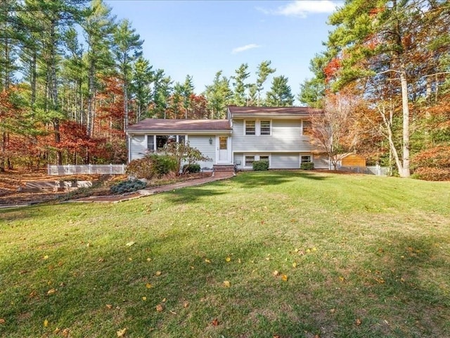 back of house with a lawn