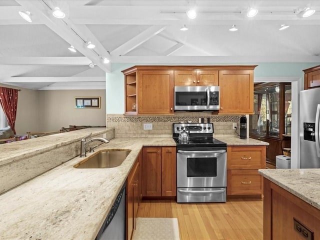 kitchen featuring open shelves, vaulted ceiling with beams, a sink, stainless steel appliances, and brown cabinets