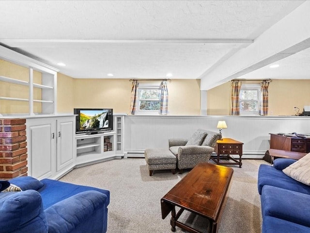 carpeted living room featuring a wainscoted wall, recessed lighting, a textured ceiling, and a baseboard radiator