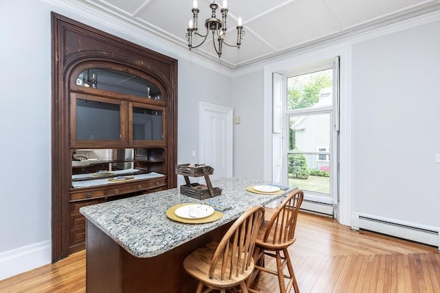 4 Mount Vernon Unit 1, Haverhill, MA 01830 - dining area featuring a chandelier, crown molding, a baseboard heating unit, and light wood-style floors