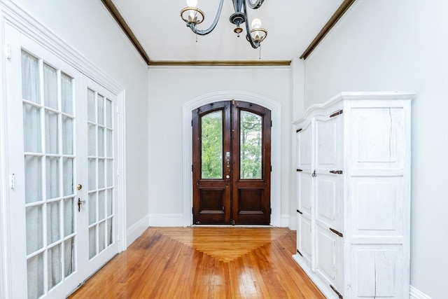 4 Mount Vernon Unit 1, Haverhill, MA 01830 - entrance foyer with french doors, light wood-style flooring, baseboards, a chandelier, and crown molding