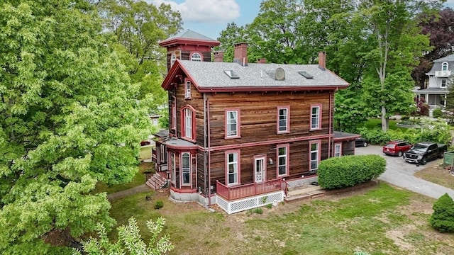 4 Mount Vernon Unit 1, Haverhill, MA 01830 - view of front of property featuring a chimney, roof with shingles, and view of wooded area
