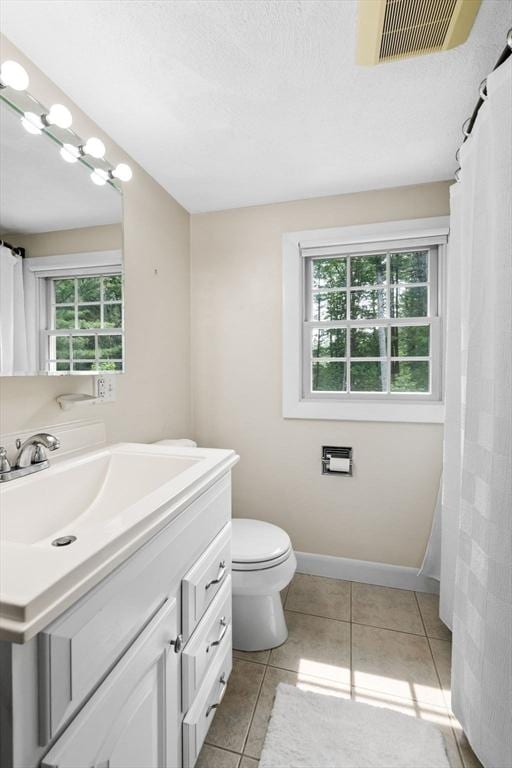 42 Howe St, Ipswich, MA 01938 - bathroom featuring vanity, tile patterned floors, toilet, and baseboards