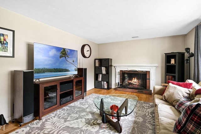 42 Howe St, Ipswich, MA 01938 - living room featuring a fireplace and wood finished floors