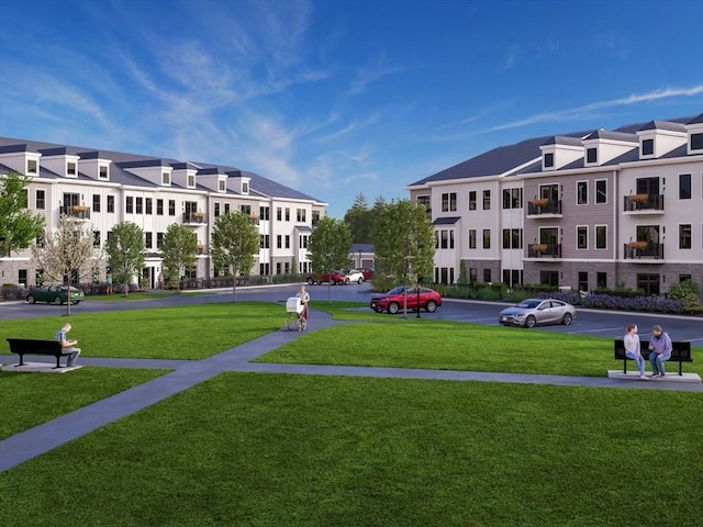 view of property's community with a lawn