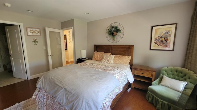 bedroom featuring baseboards, recessed lighting, and wood finished floors