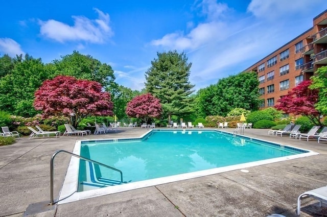 community pool with a patio area