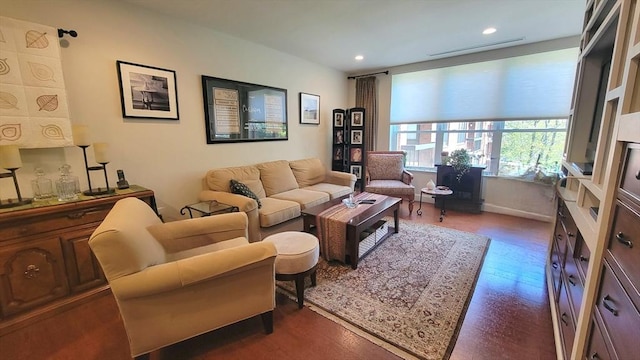 living room with recessed lighting and dark wood-style floors