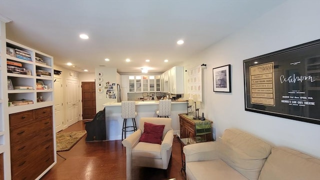 living area with recessed lighting and dark wood-type flooring