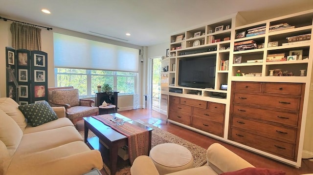 living room featuring recessed lighting, baseboards, and dark wood finished floors
