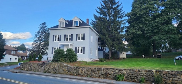 view of front of home with a front lawn