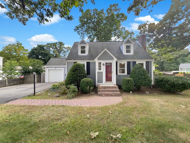 cape cod home with a front lawn and a garage