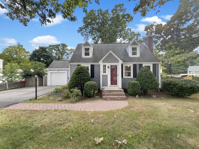 444 Lowell St, Reading, MA 01867 - cape cod home with a chimney, concrete driveway, and an attached garage