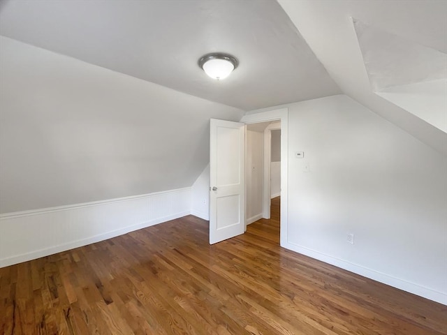 444 Lowell St, Reading, MA 01867 - additional living space with lofted ceiling, wood finished floors, and baseboards