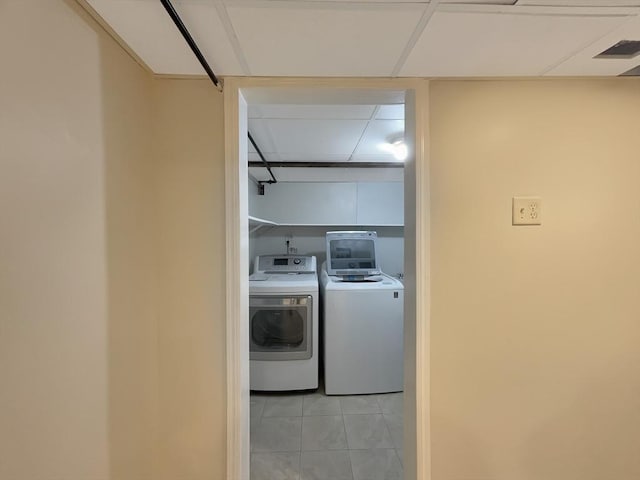 444 Lowell St, Reading, MA 01867 - laundry area featuring washer and dryer and light tile patterned floors