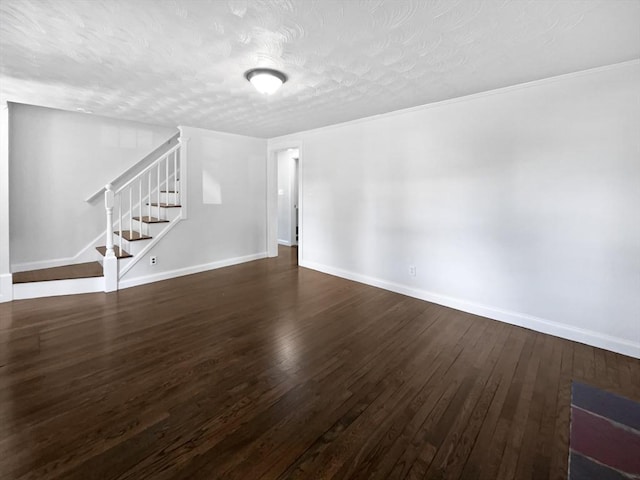 444 Lowell St, Reading, MA 01867 - unfurnished living room featuring stairway, hardwood / wood-style floors, baseboards, and a textured ceiling