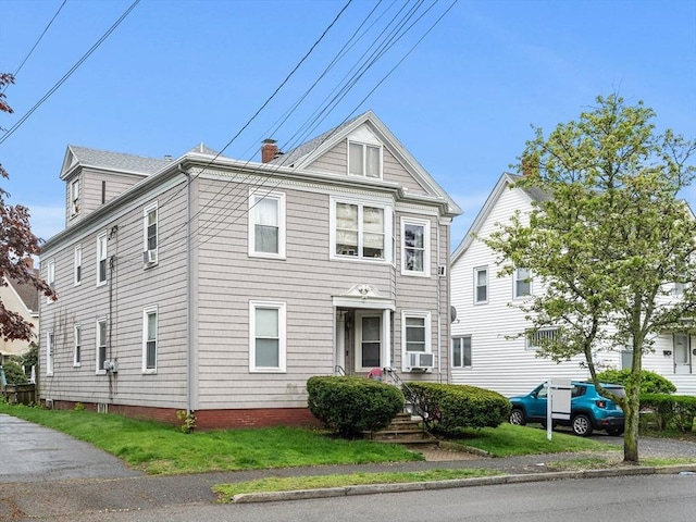multi unit property featuring a chimney