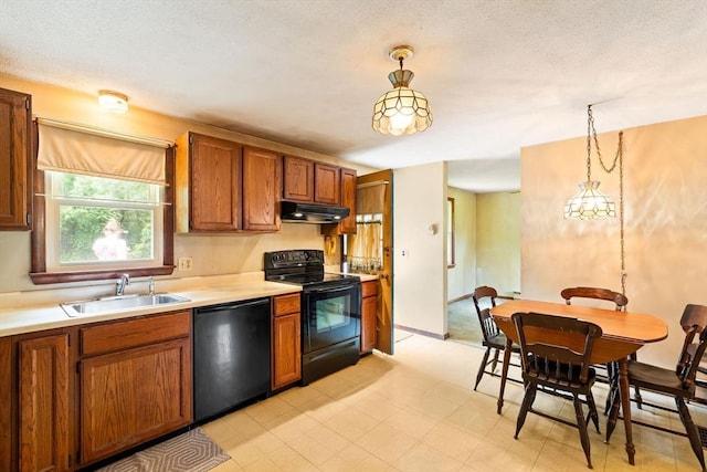 79 Chapel St, Gardner, MA 01440 - kitchen with black appliances, light countertops, pendant lighting, and under cabinet range hood