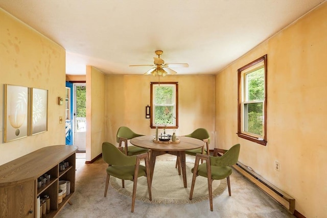79 Chapel St, Gardner, MA 01440 - dining space featuring a baseboard radiator, healthy amount of natural light, ceiling fan, and carpet flooring