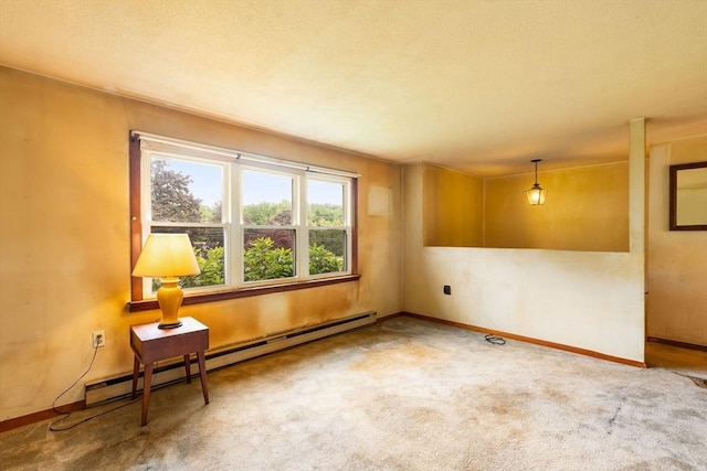 79 Chapel St, Gardner, MA 01440 - unfurnished room with a baseboard heating unit and carpet floors