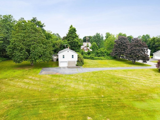 79 Chapel St, Gardner, MA 01440 - view of grassy yard with asphalt driveway and an attached garage