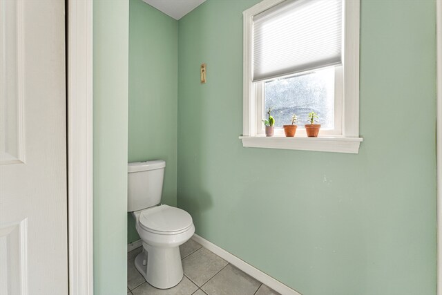 bathroom featuring tile patterned flooring and toilet