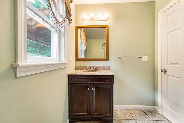 bathroom with tile patterned flooring and vanity