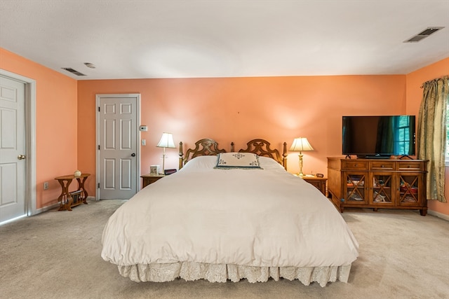 bedroom with light carpet