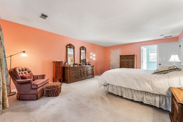 bedroom featuring light colored carpet