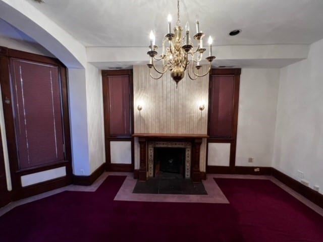 unfurnished living room with dark carpet