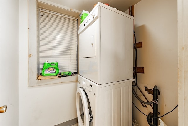 laundry area featuring stacked washer and dryer