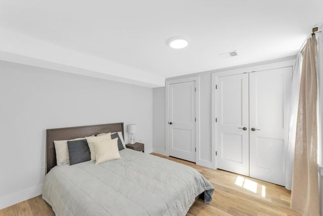 72 Rawson Rd Unit 2, Arlington, MA 02474 - bedroom with light wood-type flooring and baseboards
