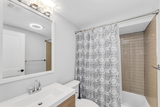 72 Rawson Rd Unit 2, Arlington, MA 02474 - bathroom with vanity, toilet, and shower / bath combination with curtain
